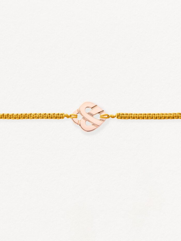 Bracelet Poiray Coeur Entrelacé sur Cordon Macramé Or Rose